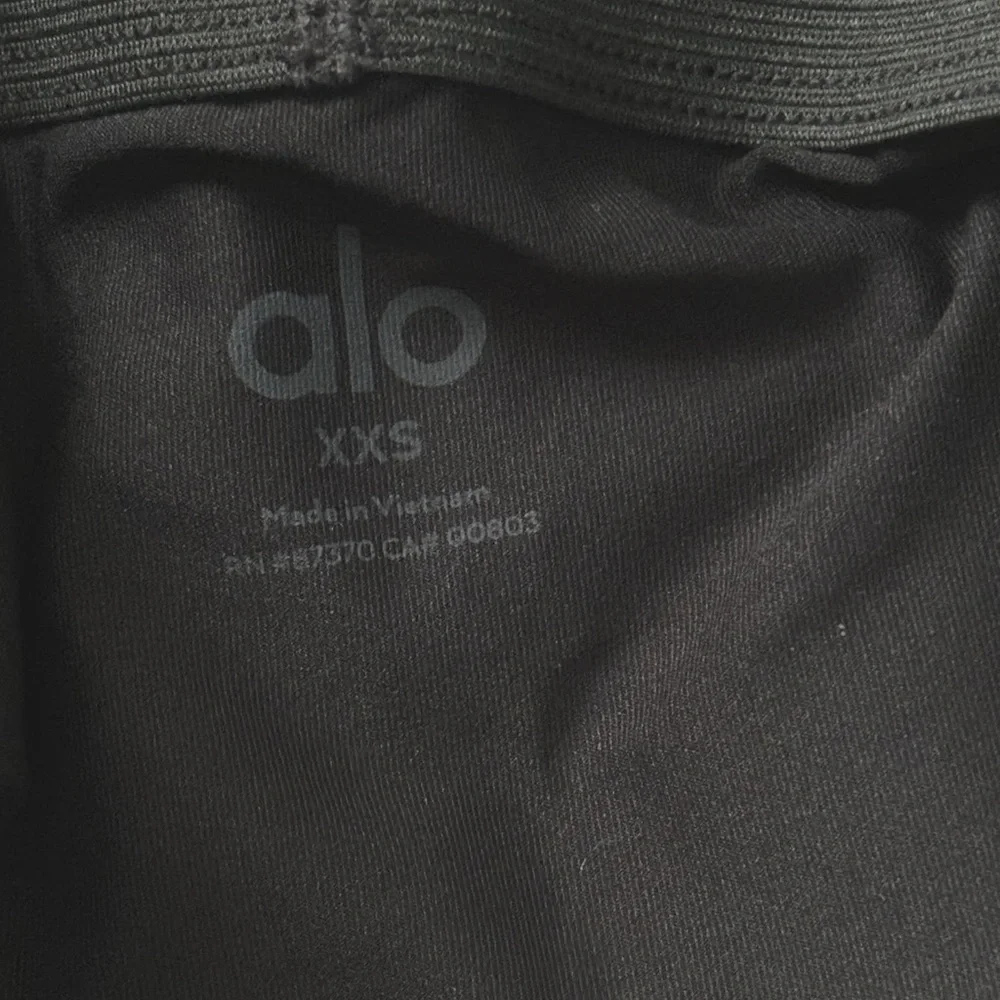 ALO Yoga Airlight Down The Line Black Mini Tennis Skirt with shorts underneath